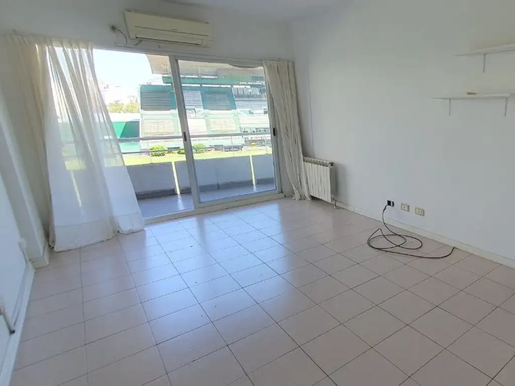 2 ambientes con balcón y cochera
