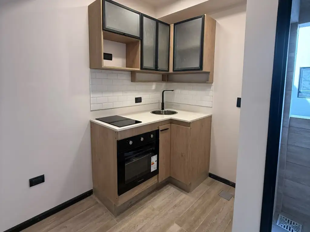 1 ambiente con balcón y terraza