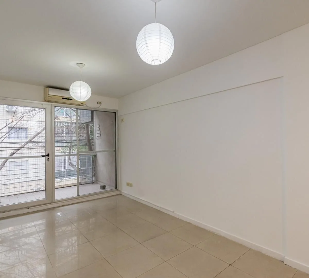 Two-room apartment with front and courtyard-facing balconies in Belgrano