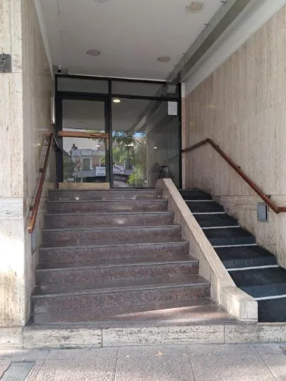 Studio with glass-enclosed balcony