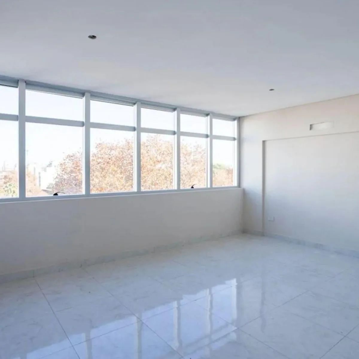 Monoambiente con terraza y gimnasio