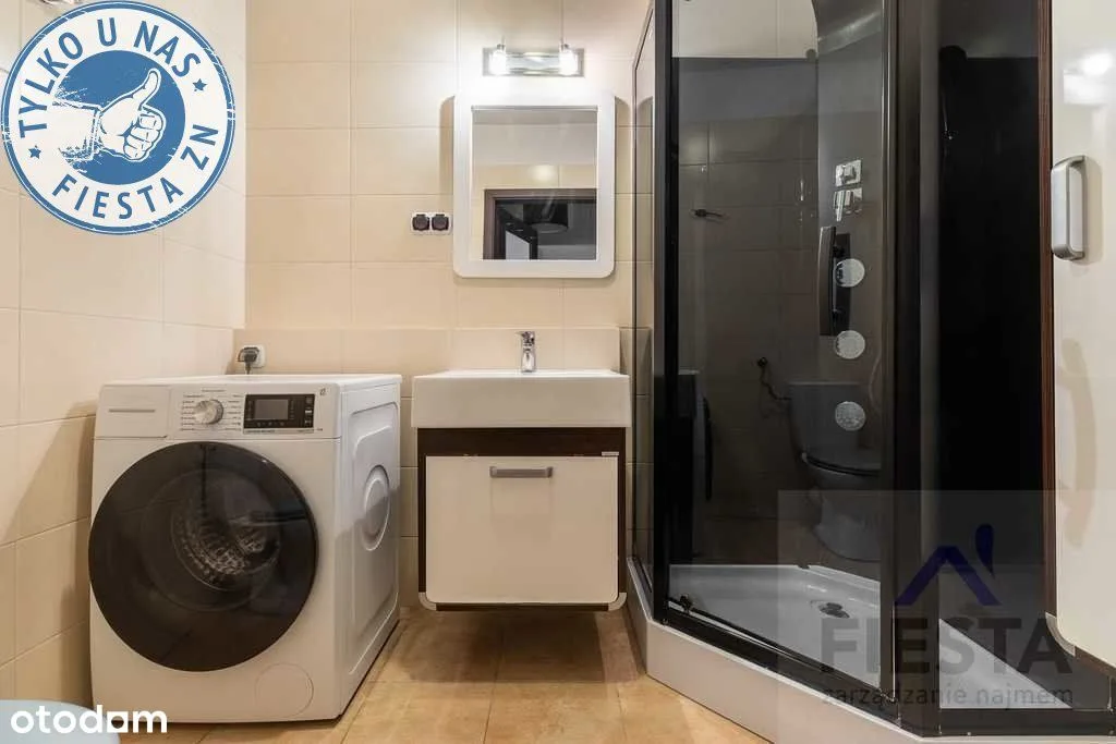 Apartamento de dois quartos com varanda e garagem em Białołęka