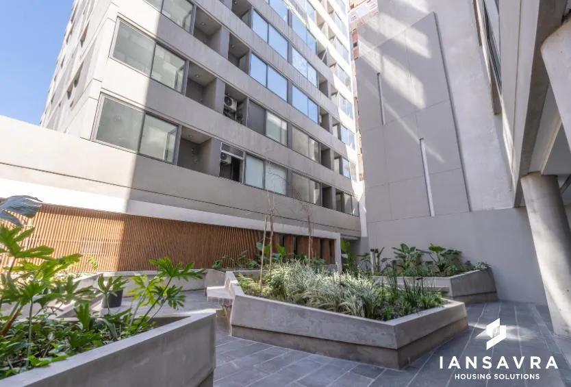 Studio with covered balcony and amenities