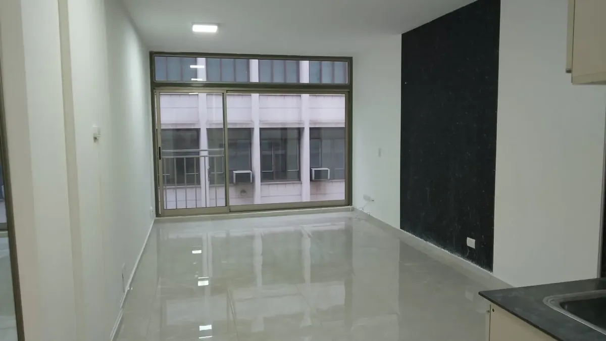 Street-facing studio with solarium