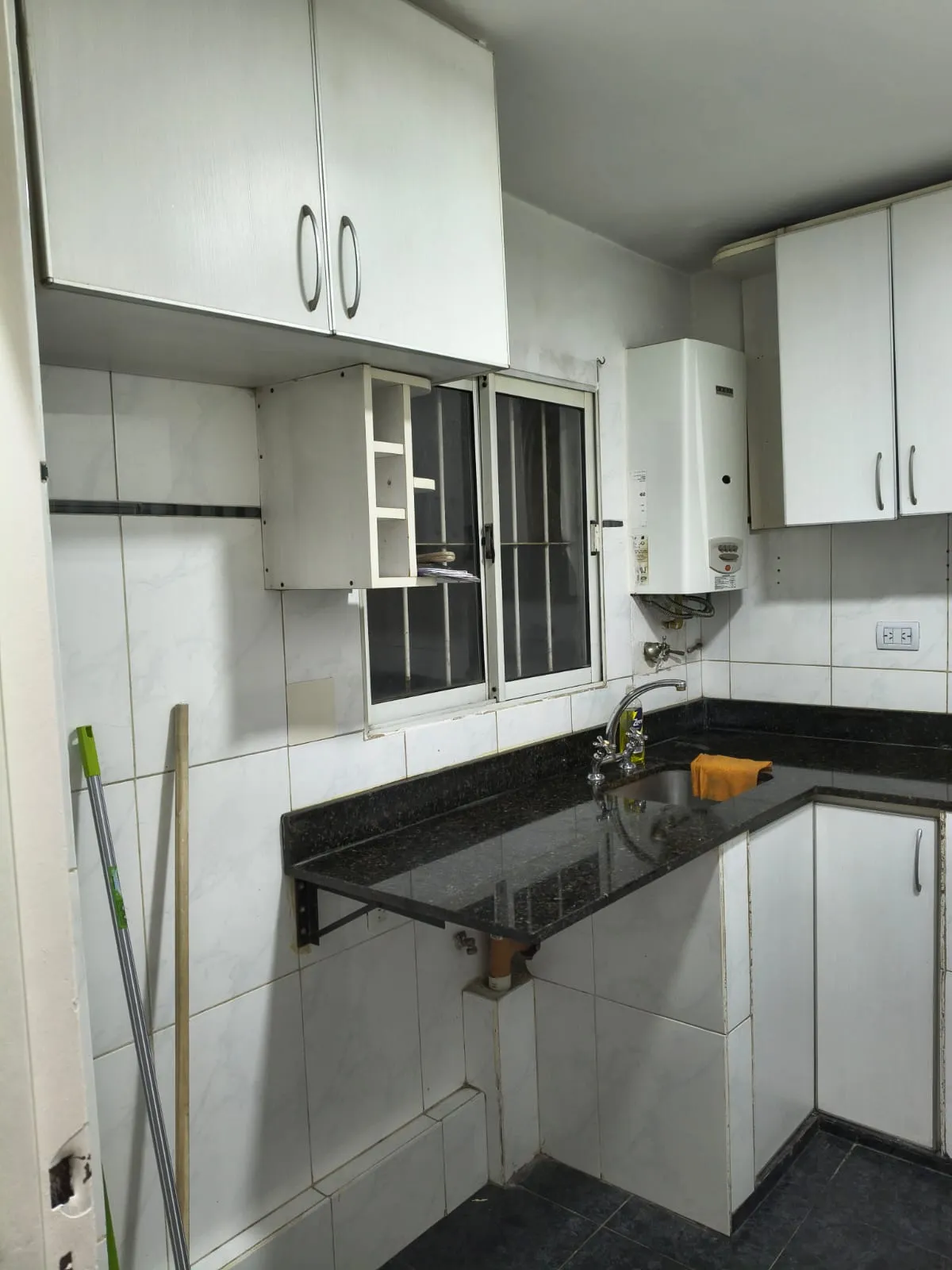 Bathroom with shower and tiles