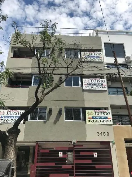 Departamento con balcón en L
