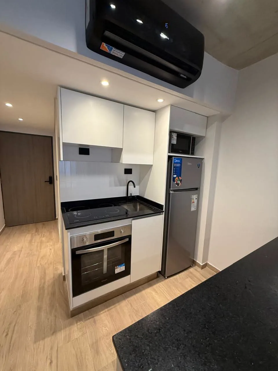 Furnished studio with balcony, kitchen