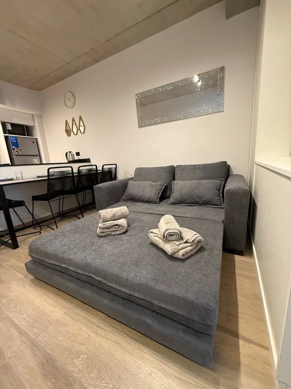 Furnished studio with balcony, bedroom